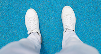 Imagen de  Person's feet, wearing white shoes