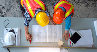 Imagen de  Workmen looking over building plans