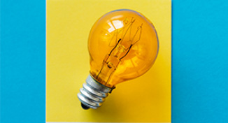 Imagen de  Light bulb against yellow square background